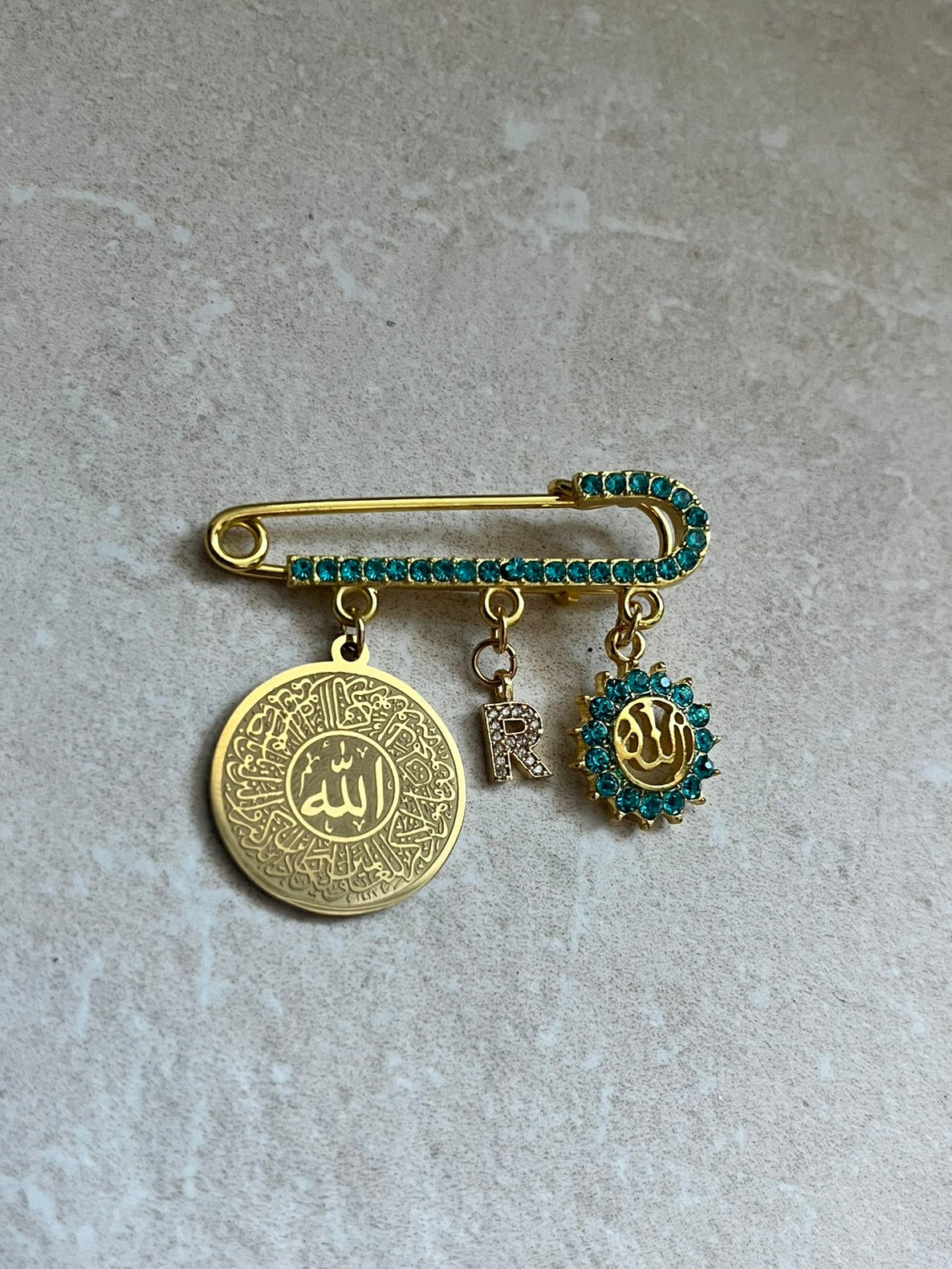 Islamische Babybrosche mit Kristallsteinchen